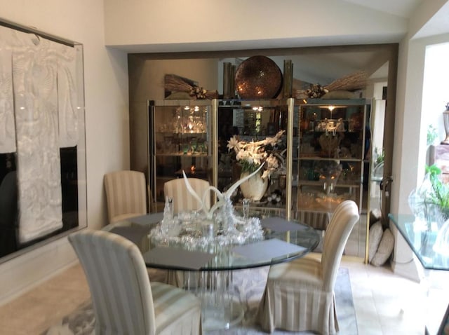 dining room featuring vaulted ceiling