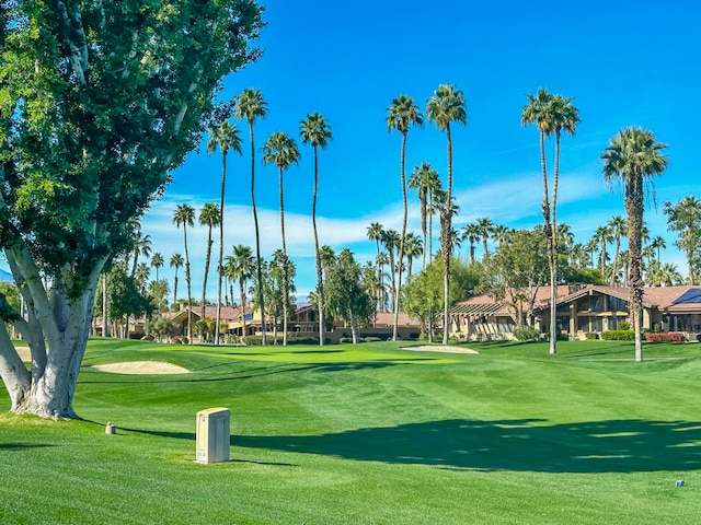 view of home's community featuring a lawn