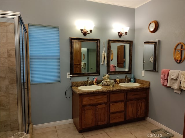 bathroom with walk in shower, tile patterned flooring, and vanity