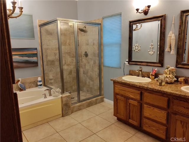 bathroom featuring shower with separate bathtub, tile patterned flooring, and vanity