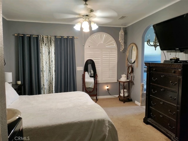 bedroom with ceiling fan and light carpet