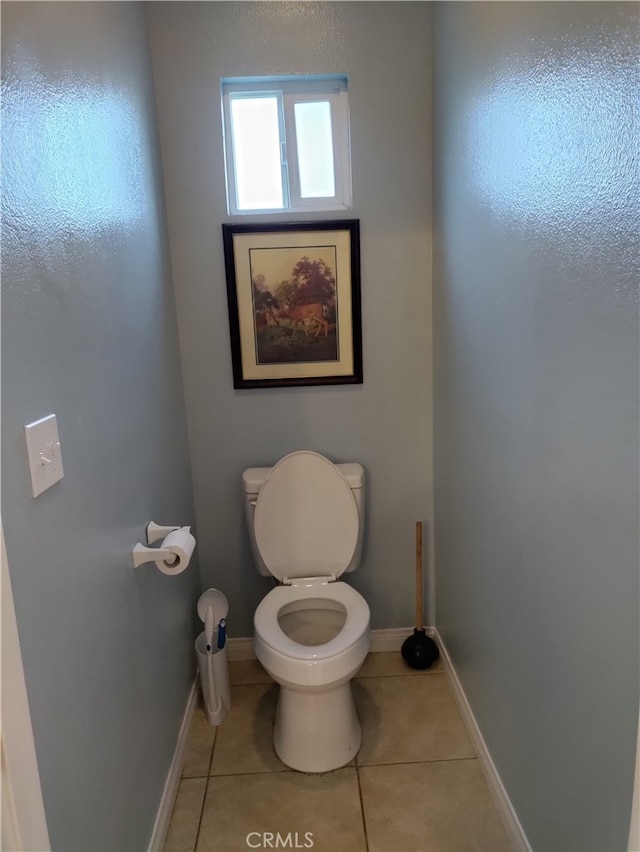 bathroom featuring tile patterned flooring and toilet