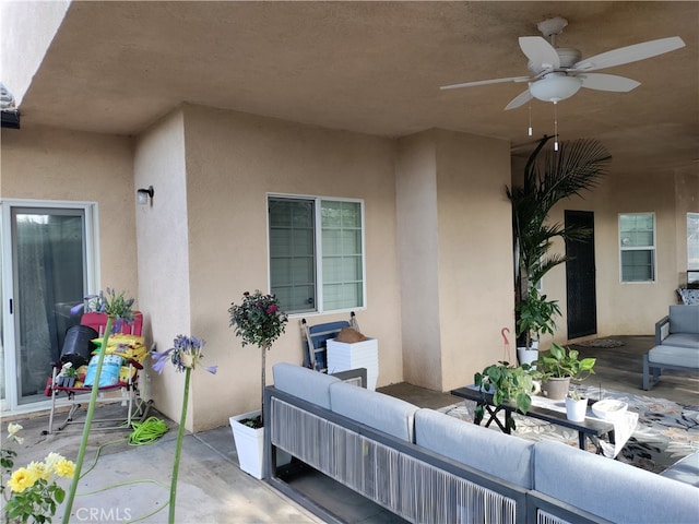 view of patio featuring ceiling fan and outdoor lounge area