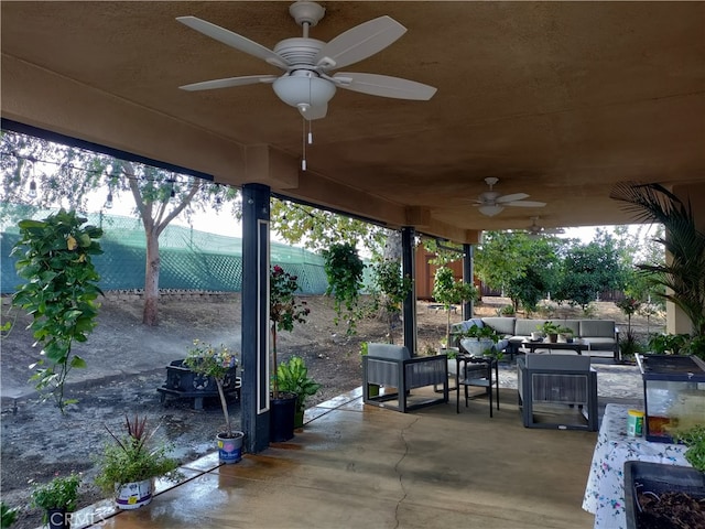 view of patio / terrace with ceiling fan and outdoor lounge area