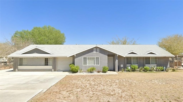 ranch-style home featuring a garage