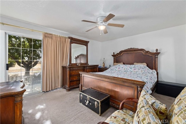 bedroom with access to outside, ceiling fan, and light carpet