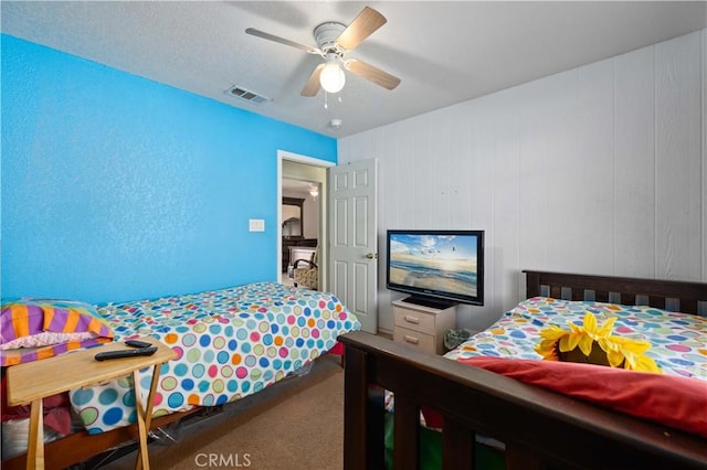 carpeted bedroom featuring ceiling fan