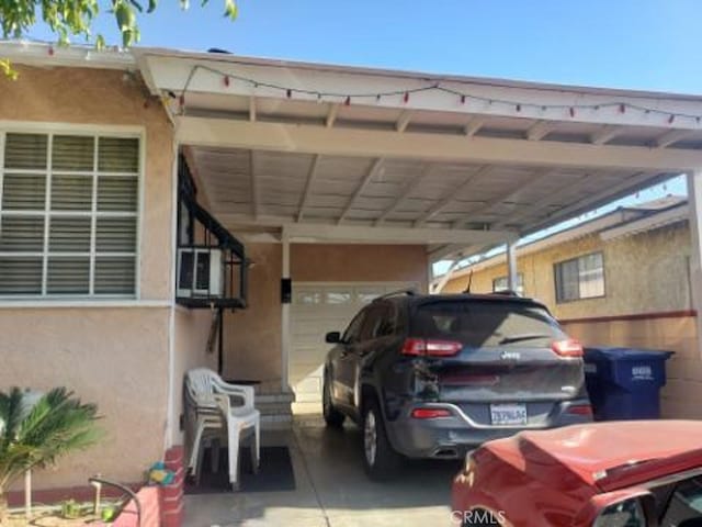 view of parking with a garage and a carport