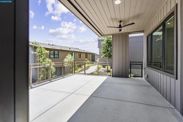 view of patio / terrace featuring ceiling fan and a balcony