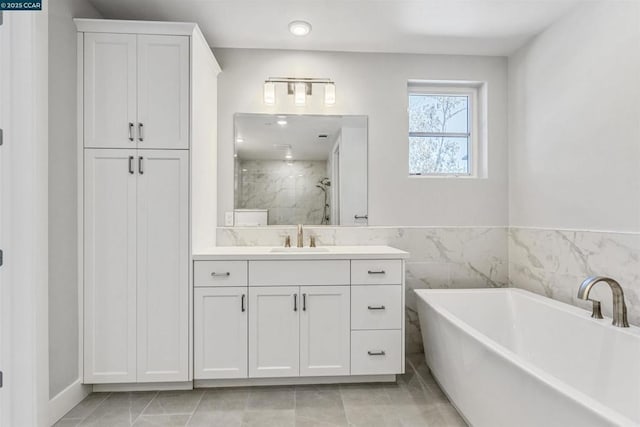 bathroom with independent shower and bath, tile patterned flooring, and vanity