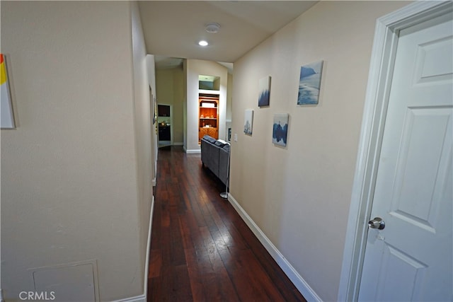 hall with dark wood-type flooring