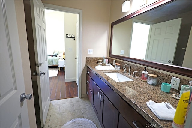 bathroom with hardwood / wood-style floors and vanity