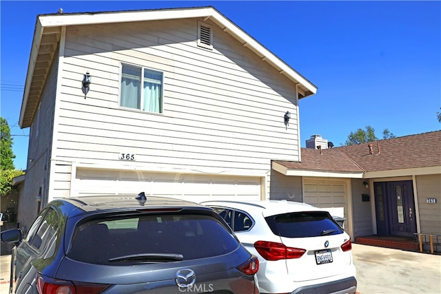 view of property exterior with a garage