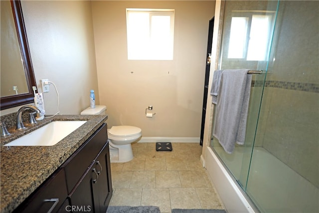 full bathroom with vanity, tile patterned flooring, enclosed tub / shower combo, and toilet