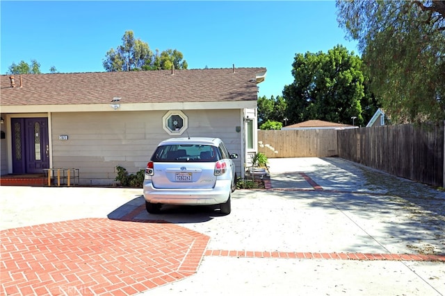 view of side of property with a garage