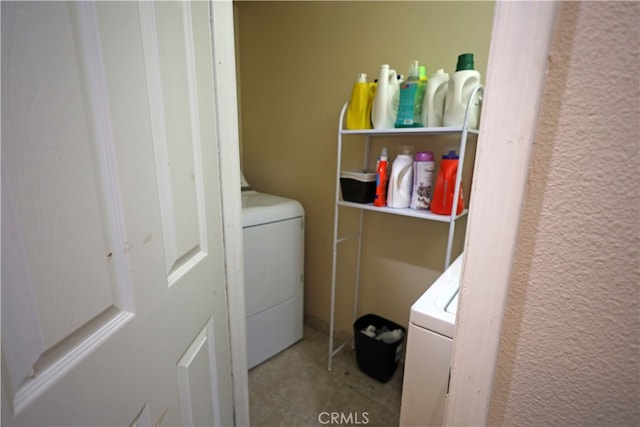 clothes washing area featuring washer / clothes dryer