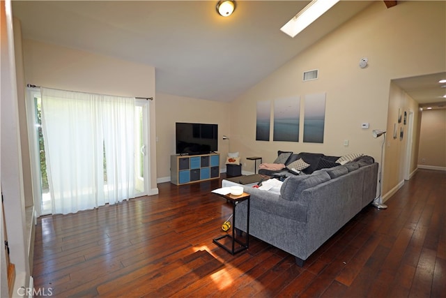 living room featuring a skylight, dark wood-type flooring, and high vaulted ceiling