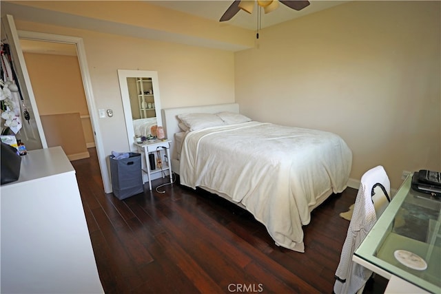 bedroom featuring ceiling fan and dark hardwood / wood-style flooring