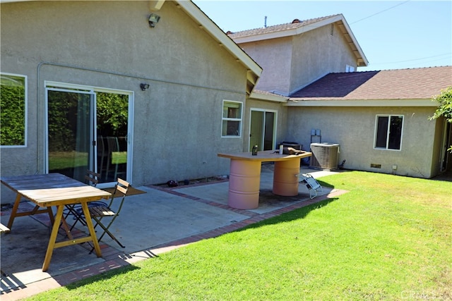 exterior space featuring a lawn and a patio area