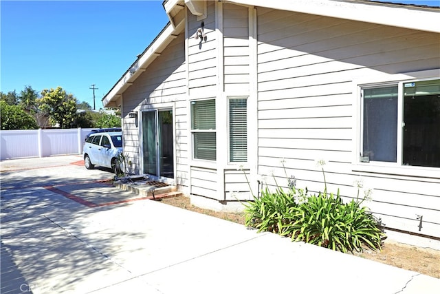 view of side of property featuring a patio area