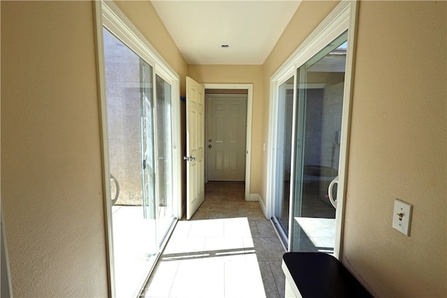 corridor with tile patterned flooring