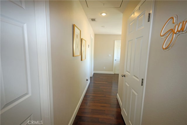 hallway with dark hardwood / wood-style floors