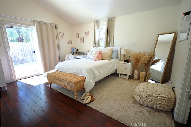 bedroom with lofted ceiling, wood-type flooring, and access to outside