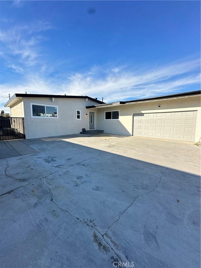 ranch-style home featuring a garage