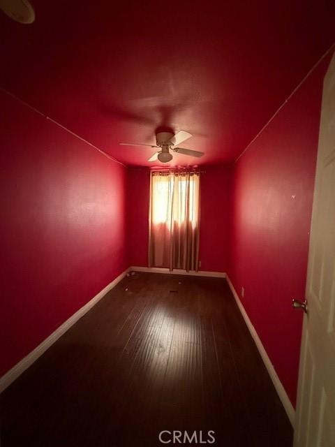 24062 Eucalyptus Ave, Moreno Valley, CA 92553 - unfurnished room featuring baseboards, a ceiling fan, and wood-type flooring