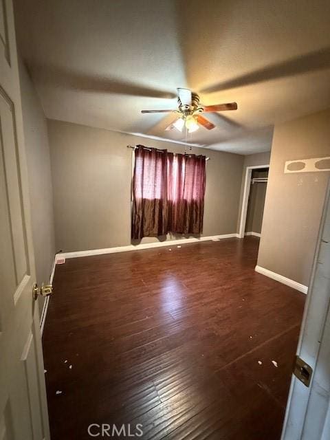 24062 Eucalyptus Ave, Moreno Valley, CA 92553 - spare room with baseboards, ceiling fan, and dark wood finished floors