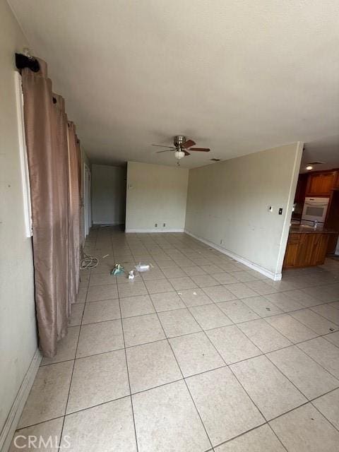 24062 Eucalyptus Ave, Moreno Valley, CA 92553 - spare room with light tile patterned floors, baseboards, and a ceiling fan