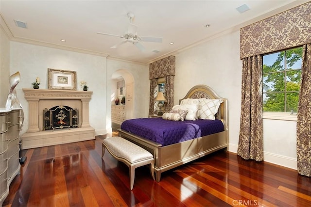 bedroom featuring ceiling fan, hardwood / wood-style floors, and ornamental molding