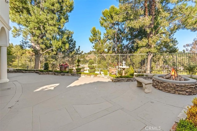 view of patio with an outdoor fire pit