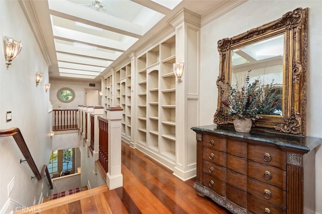 corridor with dark hardwood / wood-style flooring and crown molding