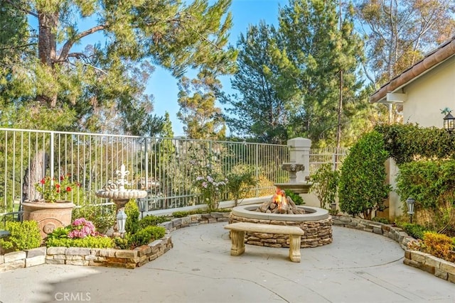 view of patio / terrace featuring a fire pit