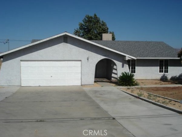 single story home featuring a garage