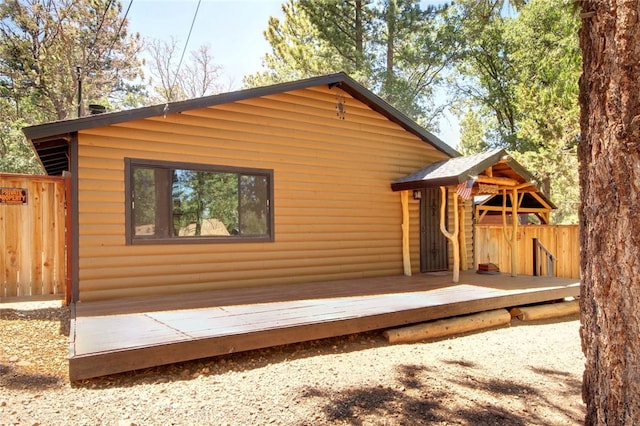 rear view of property with a deck