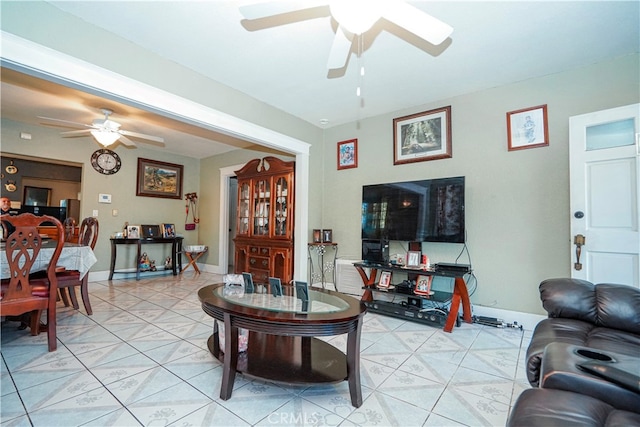 living room with light tile patterned floors and ceiling fan