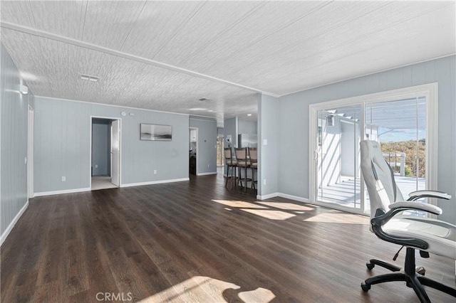 unfurnished office featuring a textured ceiling and dark hardwood / wood-style flooring