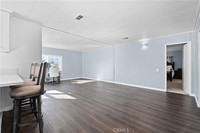 living room featuring dark wood-type flooring