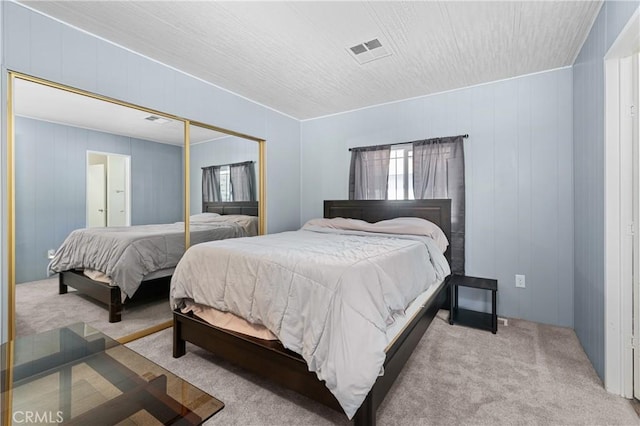 carpeted bedroom featuring a closet