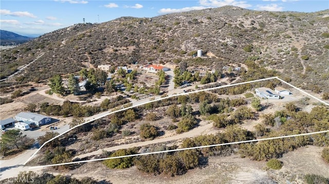 drone / aerial view featuring a mountain view