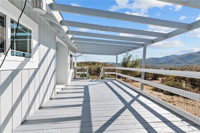 wooden terrace featuring a mountain view