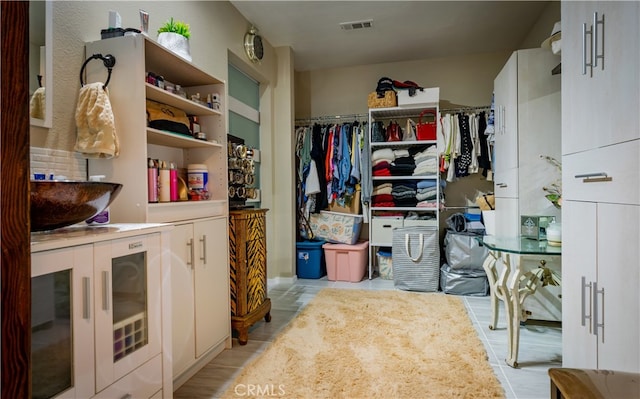 walk in closet featuring light wood-type flooring