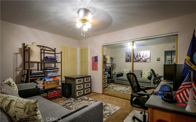 office space featuring ceiling fan and carpet floors