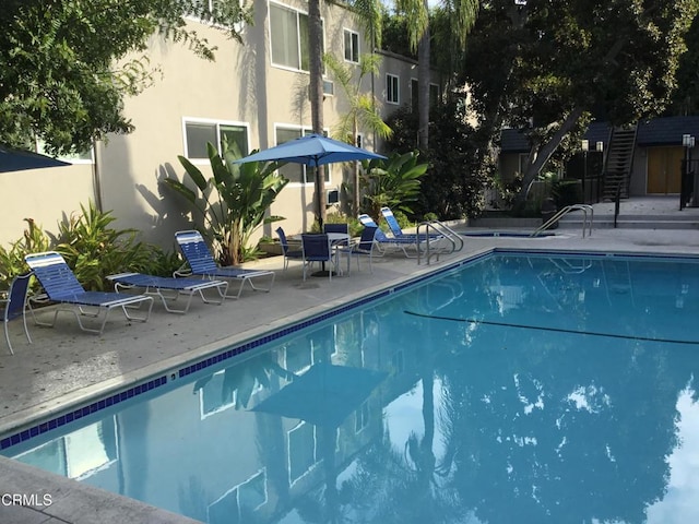 view of pool featuring a patio area