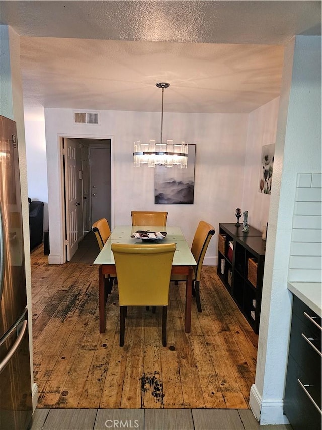 dining room with dark wood-type flooring