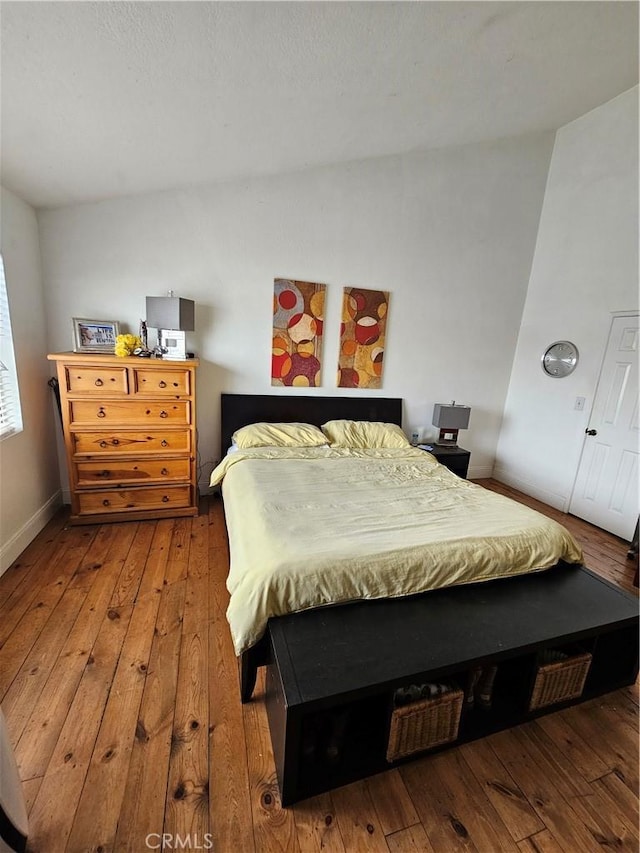 bedroom with hardwood / wood-style floors