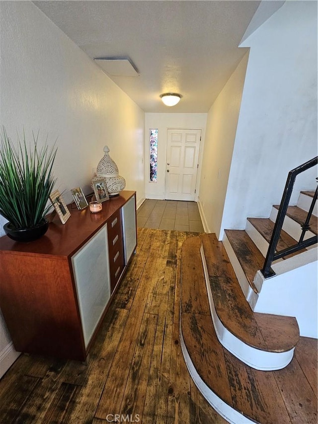 entryway with dark wood-type flooring