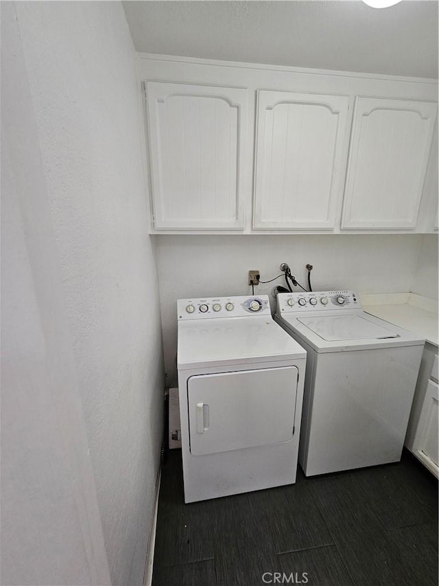 laundry room with cabinets and separate washer and dryer